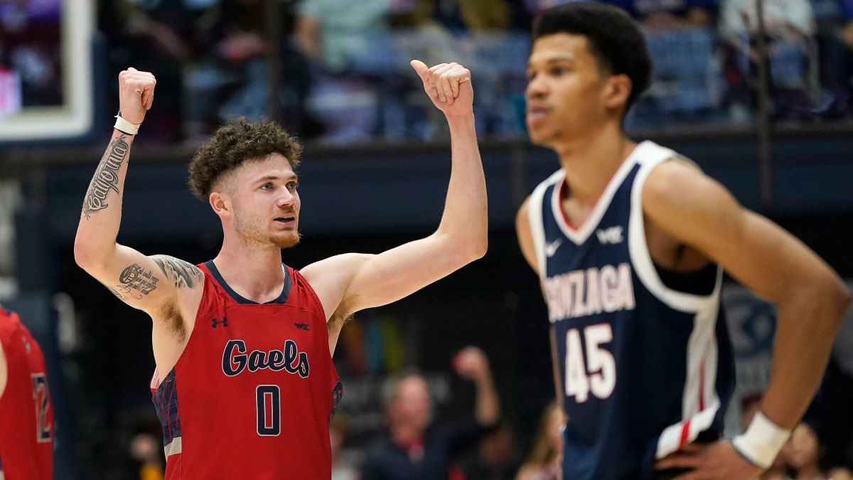 Saint Mary’s Logan Johnson lifts his arms in celebration vs Gonzaga